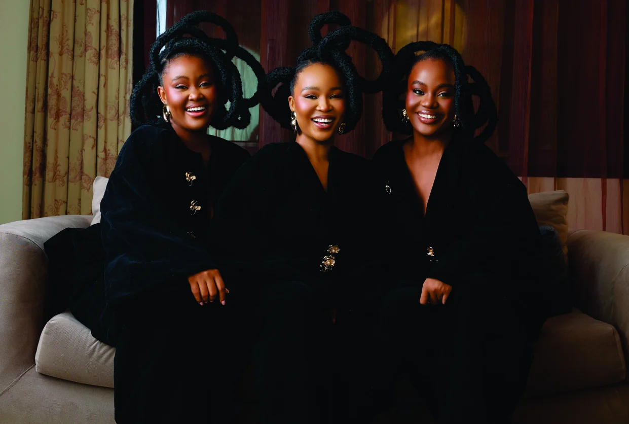 The LadyBeellionaire Sisters seated together, laughing