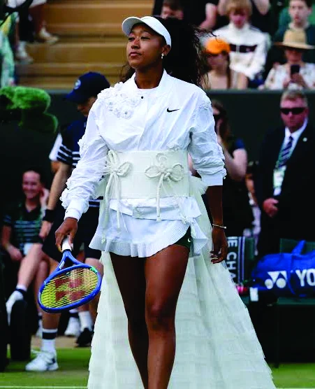 Naomi Osaka at Wimbledon in an all-white kimono-inspired walk-on look