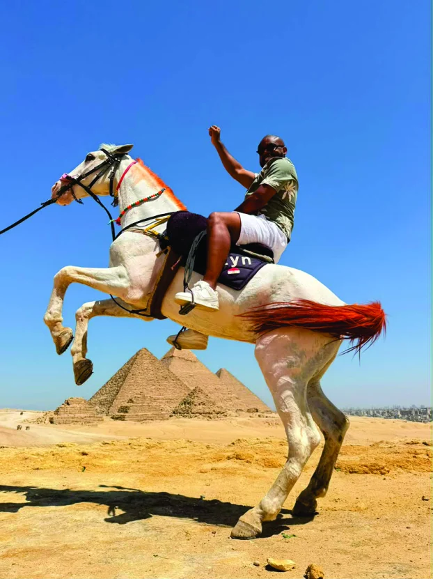 WakaWaka Doctor on horseback in front of the Giza pyramids