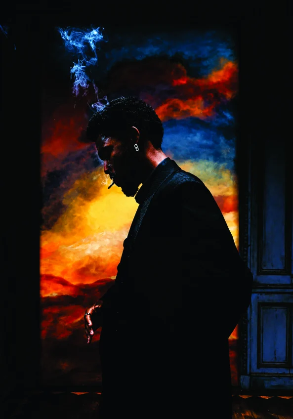 Afrobeats single artwork — silhouette against a burning sky