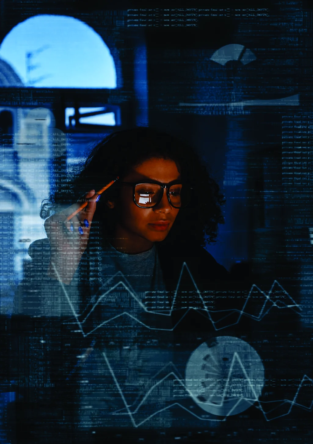 A woman in glasses studying data behind a translucent code overlay